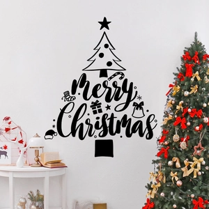 Close-up of black Merry Christmas tree wall decal in a cozy white living room setting