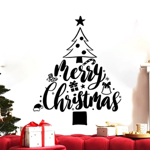 Detail of Merry Christmas wall decal with tree silhouette on white wall interior