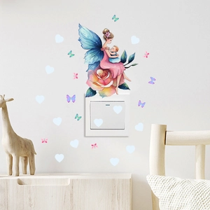 Detailed wall sticker featuring a cartoon fairy and butterflies applied near a light switch