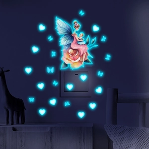 Luminous wall stickers showing a glowing fairy with hearts and butterflies in the dark