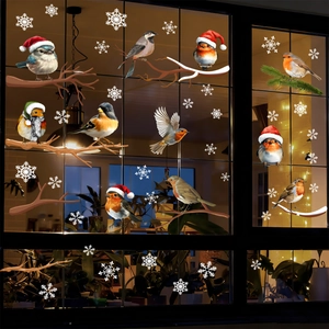 Christmas window decals with birds, snowflakes and branches for festive shop decoration