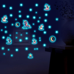 Luminous unicorn and stars wall stickers glowing blue in dark bedroom for kids room decor