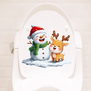 Detail of cartoon snowman and reindeer Christmas stickers on a white toilet lid cover