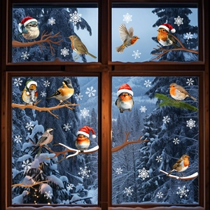 Detailed view of Christmas birds with Santa hats and snowflakes on window static stickers