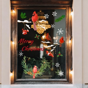 Christmas window decals with red birds, snowy pine branches and Merry Christmas text