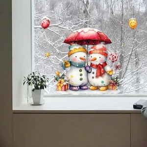 Macro detail of Christmas snowman window stickers with umbrella and watercolor gift boxes