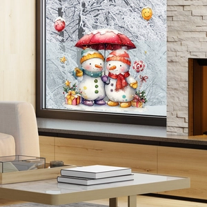 Detail of Christmas snowman window stickers with red umbrella and festive decor items