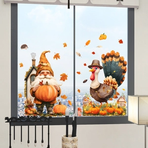 Detail of fall window clings showing cute gnomes, pumpkins, and maple leaves on glass