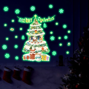 Luminous Christmas tree and snowflake wall stickers glowing green in the dark for home decor