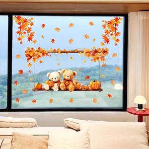 Detail showing two cartoon bears on a swing with autumn pumpkin window static stickers