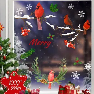 Detail of Christmas window clings showing realistic red cardinal birds and snow on branches