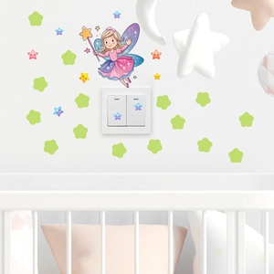 Luminous fairy and stars wall stickers applied around a light switch in a nursery room