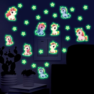 Glow-in-the-dark unicorn and stars wall stickers shining around a light switch