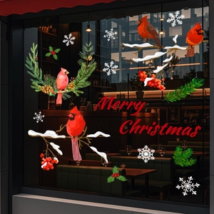 Detailed Christmas window stickers featuring red cardinals and snowy pine branches on glass