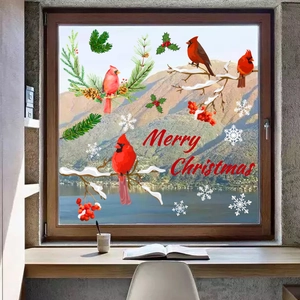 Detail of Christmas window clings featuring red cardinals, snowy branches and Merry Christmas text