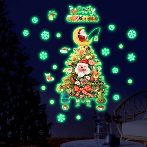 Macro shot of glow-in-the-dark Christmas tree wall decals with Santa and green luminescence