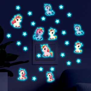 Detailed glowing unicorn and star wall stickers showing luminous effect in dark rooms