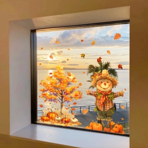 Detail of harvest scene window stickers featuring maple tree, scarecrow, and pumpkins
