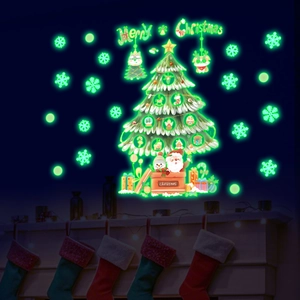 Luminous Christmas tree wall sticker glowing green with Santa and snowflakes in dark room