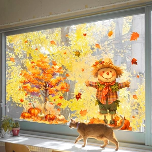 Detail of harvest window stickers featuring scarecrow, maple tree and pumpkins on glass