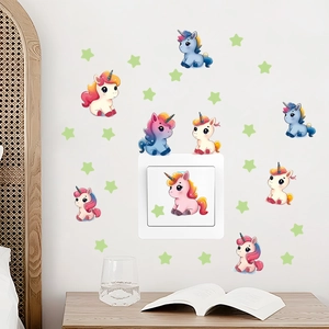 Luminous unicorn and stars wall decals on a bedroom light switch for kids room decor