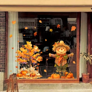 Detail of harvest window clings featuring a cute scarecrow, maple tree, and pumpkins