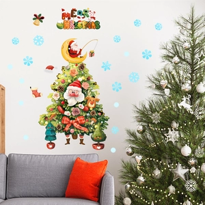 Detailed Christmas tree wall decal with Santa Claus and reindeer on a white wall