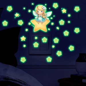 Luminous wall decal showing a glow-in-the-dark fairy girl on a star in a bedroom