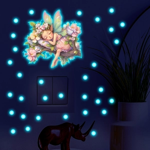 Sticker mural lumineux montrant une fée dormant sur une branche fleurie et points bleus
