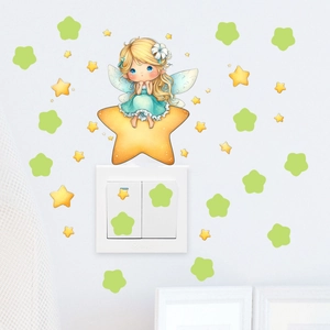 Luminous wall sticker showing a fairy on a yellow star for home wall decoration