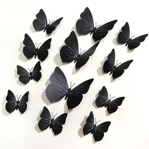Set of 12 black 3D butterfly wall stickers with textured wings for home decoration