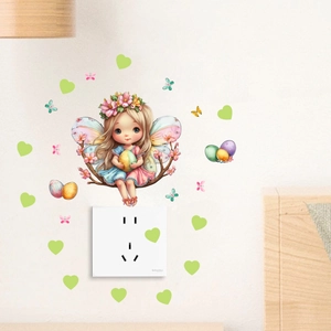 Detailed view of fairy wall stickers with butterflies and hearts on a white wall