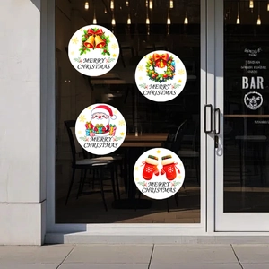 Détail de stickers de fenêtre de Noël circulaires avec Père Noël et couronnes de fête