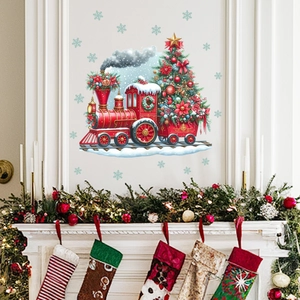 Festive Christmas train wall decal with snowflakes applied above a fireplace mantel decor