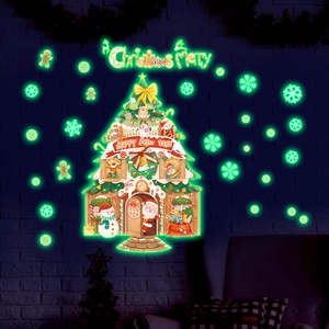 Glow in the dark Christmas tree wall sticker with Santa and reindeer on a brick wall
