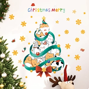 Detail of glow-in-the-dark Christmas wall sticker featuring a cartoon cat and dog tree
