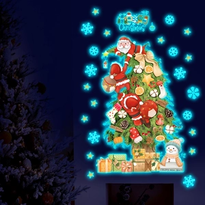 Luminous Christmas tree wall sticker with Santa and snowman glowing in the dark room