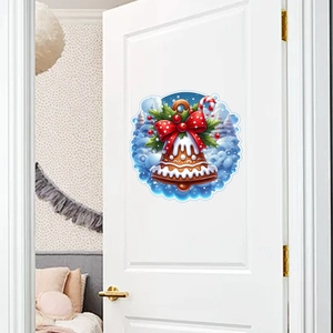 Detailed Christmas bell wall sticker with holly and bow on a white indoor door