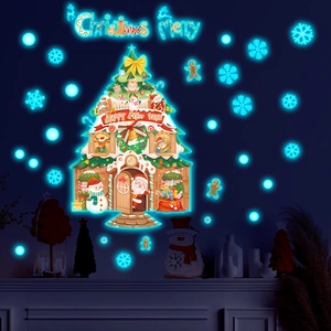 Glow-in-the-dark Christmas tree wall stickers with Santa Claus and festive snowflakes