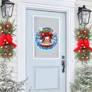 Close-up of Christmas snowman bell wall decal applied to a glass door with snow scenery