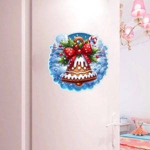 Close-up of Christmas gingerbread bell wall sticker on white door with snowy forest scene