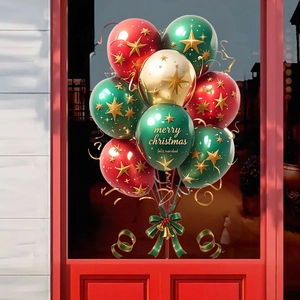 Close-up of Christmas balloons with gold stars and festive Merry Christmas lettering