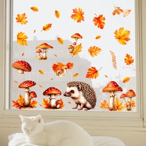 Detailed view of autumn window clings featuring maple leaves and a cute hedgehog