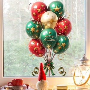 Detail of Christmas balloons with gold stars and Merry Christmas text on a cozy window