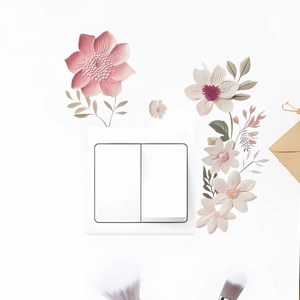 Pastel floral wall stickers surrounding a white double rocker light switch on a wall