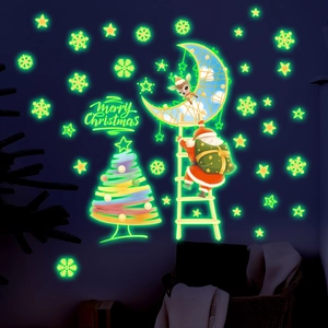 Luminous Christmas wall stickers showing Santa on a ladder and a glowing star tree