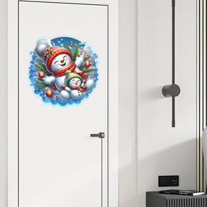 Detailed close-up of a round Christmas snowman wall sticker on a modern white bedroom door