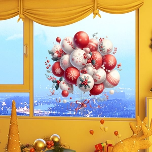 Detail view of festive balloon-shaped window stickers with snowflakes and holly elements