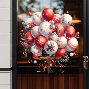 Detail of festive Christmas window stickers with red and white balloon patterns and snowflakes