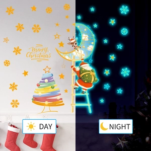 Glow-in-the-dark Christmas wall stickers showing day and night luminous effect contrast